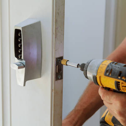 Man installing of the door with lock key security